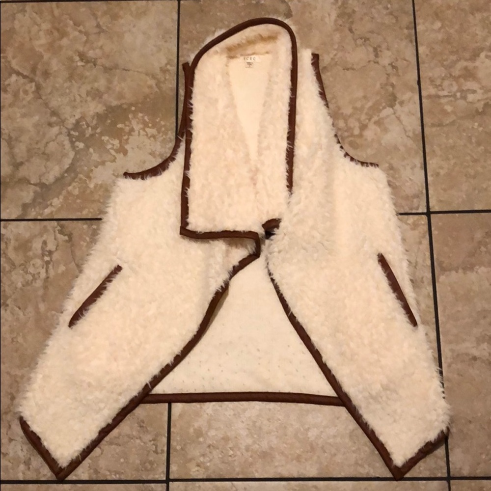 Fuzzy white faux fur with brown trim vest